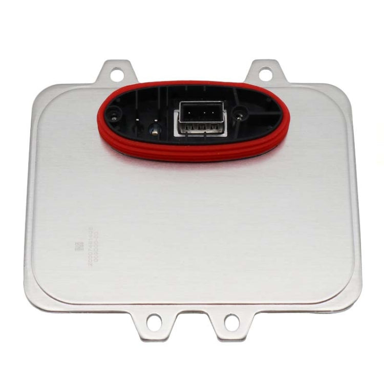 Xenon headlight ballast module with red connector port on silver housing