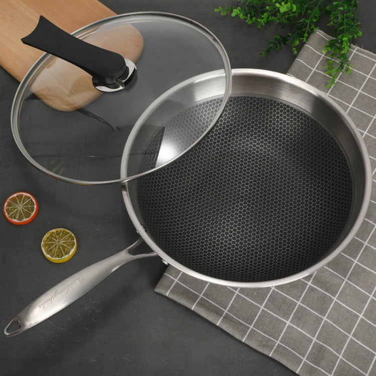 32cm stainless steel wok with black textured interior, glass lid, and two side handles