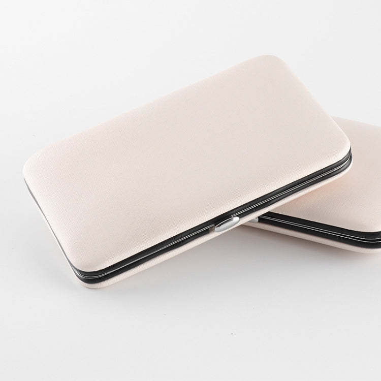 Stainless nail tool case with beige/pink cover and black trim edge