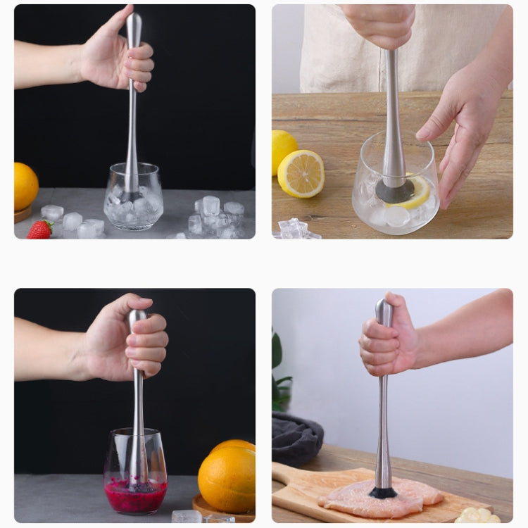 Stainless steel fruit and ice muddler shown in hand mashing drinks and fruit
