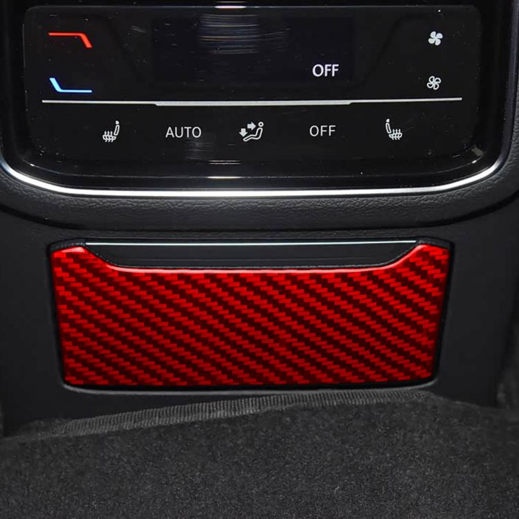 Red carbon-fiber charging port decorative trim on rear seat panel.