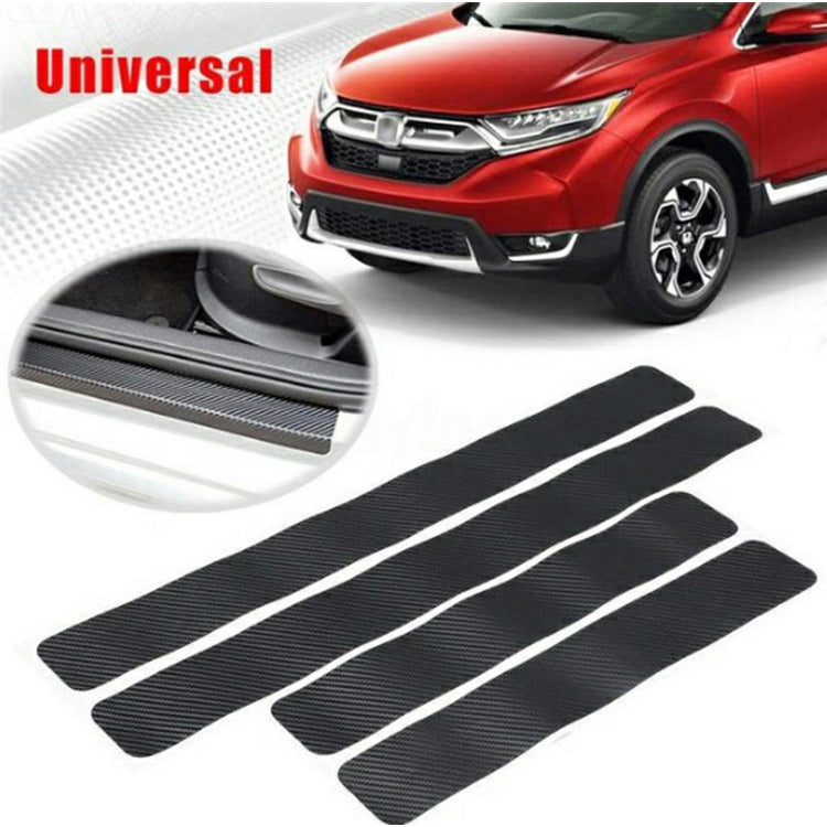 Black carbon fiber door sill protector strips, four-piece set laid out flat