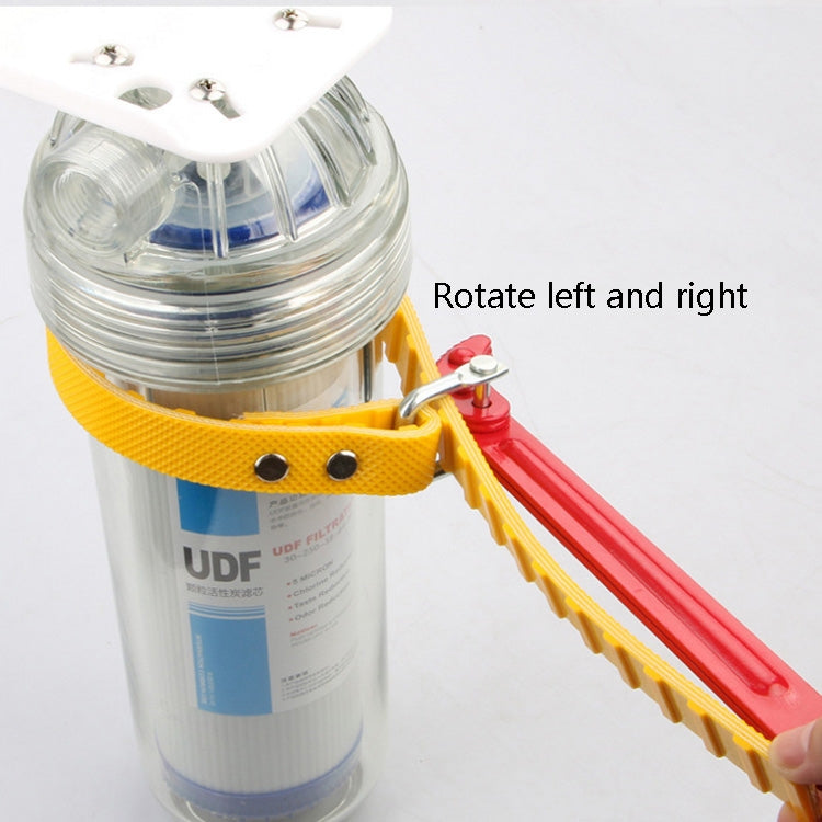 Water purifier belt wrench attached to clear water filter housing