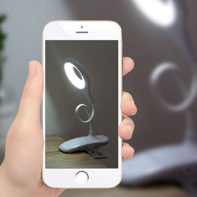 White LED desk lamp shown on a smartphone screen for control.