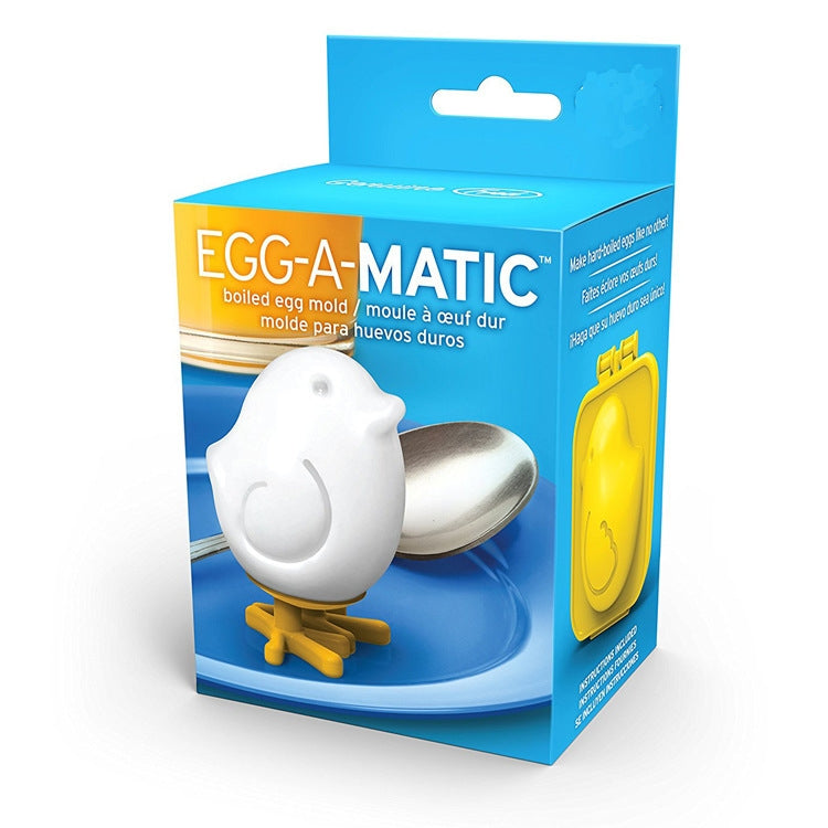 EGG-A-MATIC silicone egg mold set with white egg figure and metal spoon