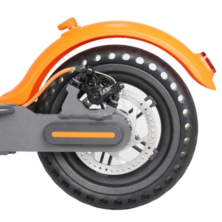 Electric scooter wheel with disc brake rotor and front caliper on orange fender
