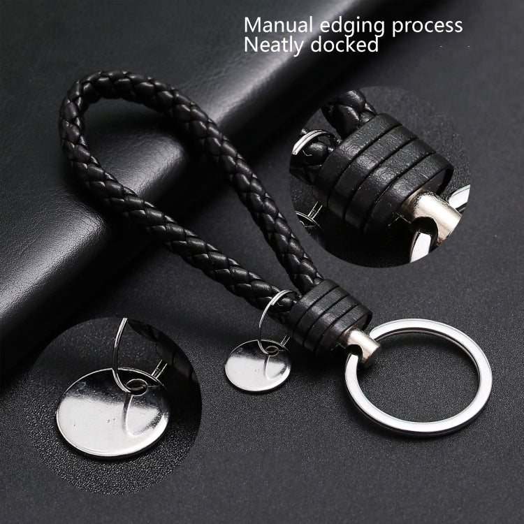 Black woven leather keychain with silver key ring, braided cord loop, and round discs
