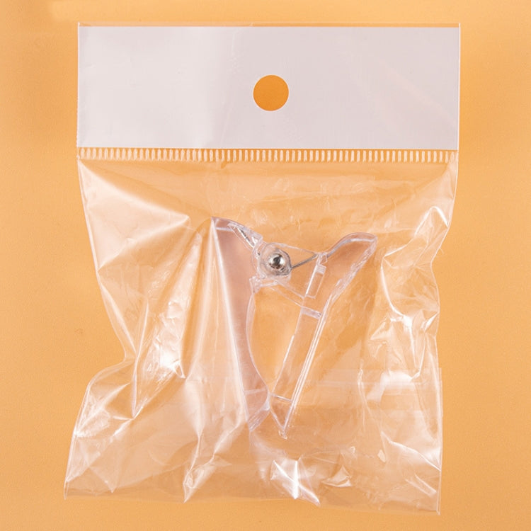 Clear nail crystal shaping clip sealed in a plastic storage bag