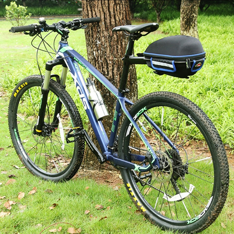 Black bicycle tail bag with blue trim mounted on rear of mountain road bike