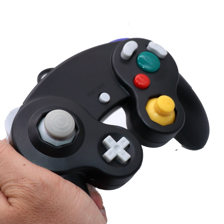 Black wired game controller close-up with D-pad, action buttons, and analog sticks