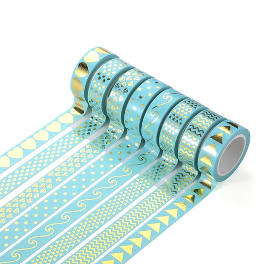 Turquoise patterned paper tape roll with gold icons and wavy swirls
