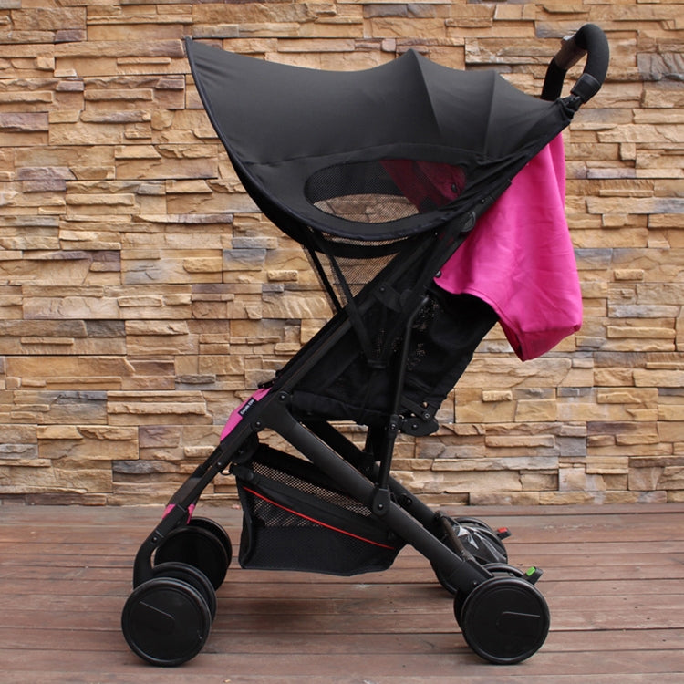 Black stroller UV sunshade canopy on stroller, with pink fabric panel visible