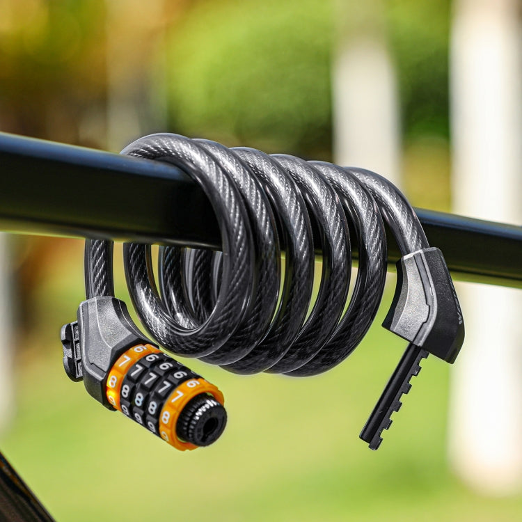 Black coiled bike password lock looped around a bar with orange number dial