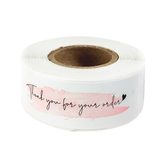 White thank-you label sticker roll with pink watercolor “Thank you for your order” text