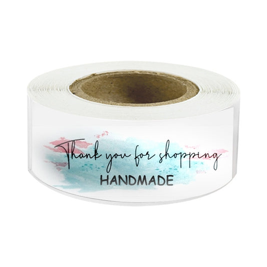 White label sticker roll with blue and pink wash “Thank you for shopping” and “HANDMADE”
