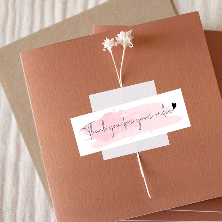 Thank-you label sticker on brown card with pink watercolor “Thank you for your order”