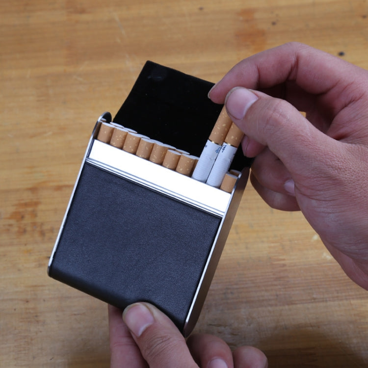 Black leather-look magnetic cigarette case with metal frame, open lid held by hands