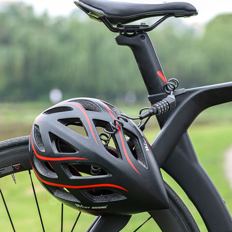 Cable lock looped through a black bicycle helmet, with coiled steel cable