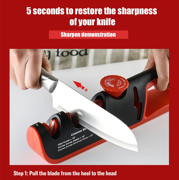 Manual knife sharpener with black and orange body as a knife blade is pulled through