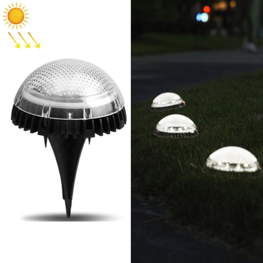 Solar LED underground lawn light with clear dome lens and black spike base