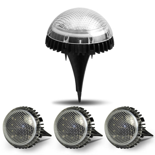 Three solar LED underground lights with round mesh dome tops and black spikes