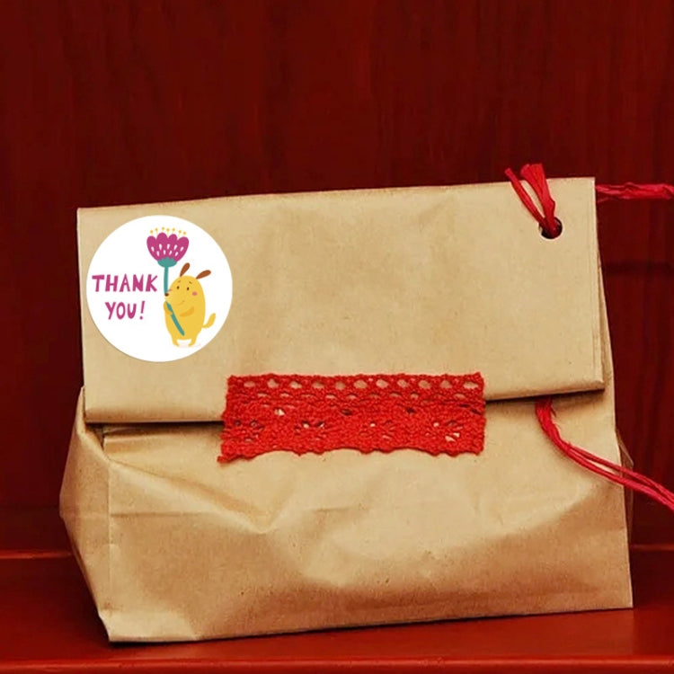 Kraft parcel with round “Thank you” chick seal sticker and red string