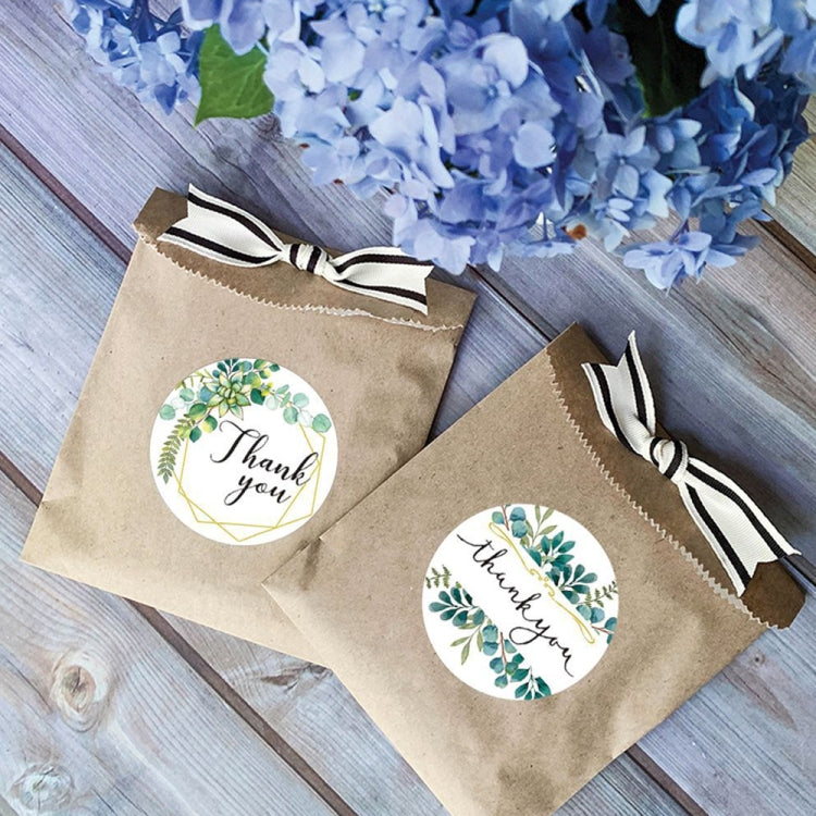 Thank you floral round stickers on kraft gift bags, green wreath with gold script