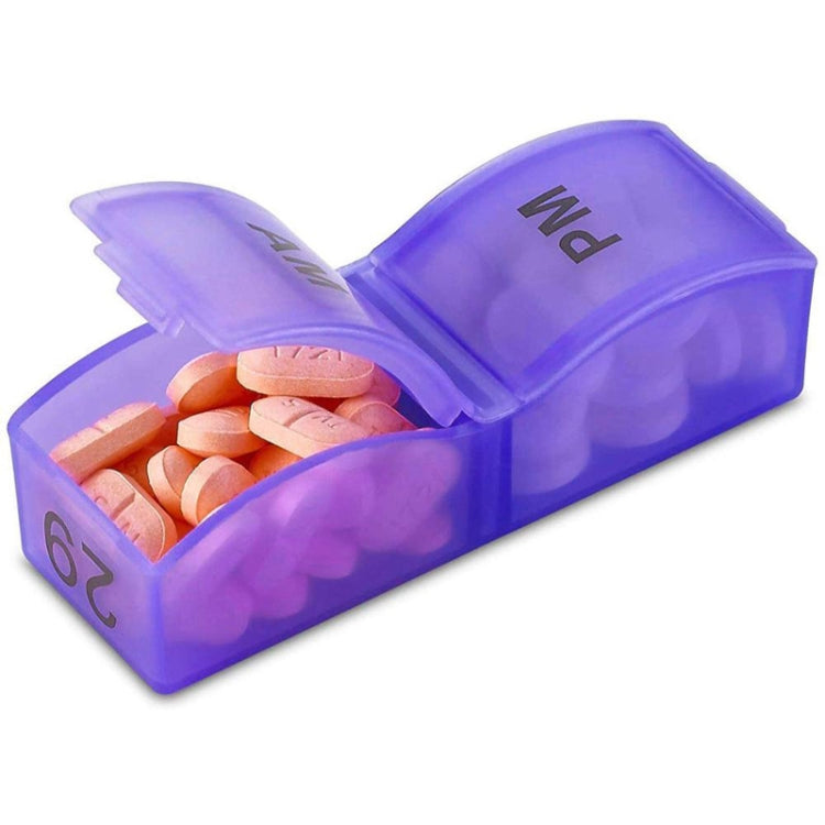 Purple plastic pill organizer with open lid and orange tablets in numbered compartment