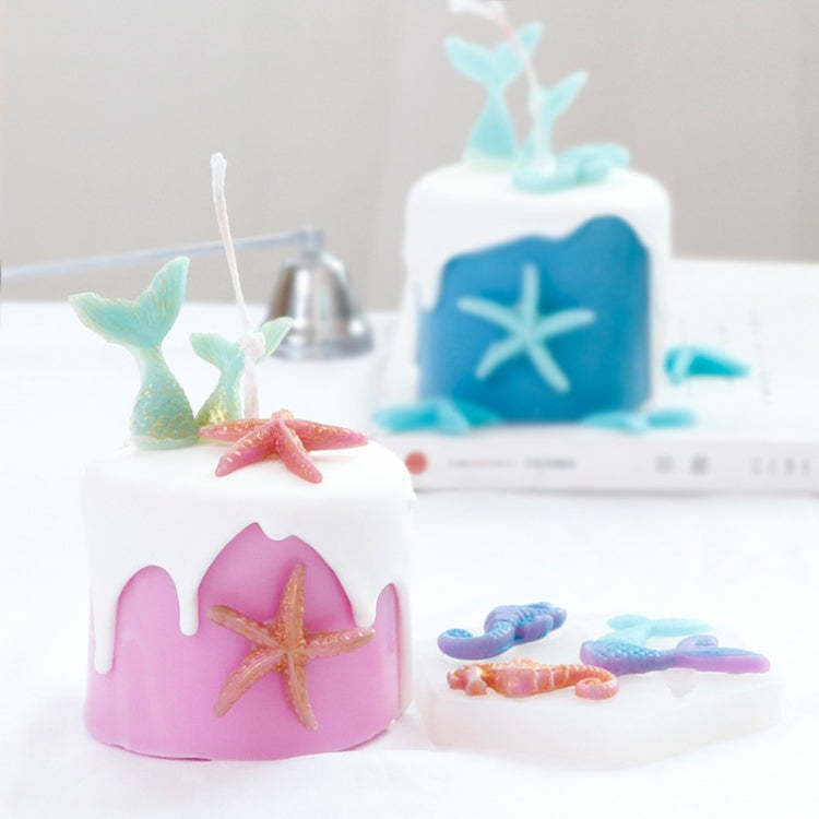 Pink and blue silicone mold casts with starfish and seahorse shapes on a tray