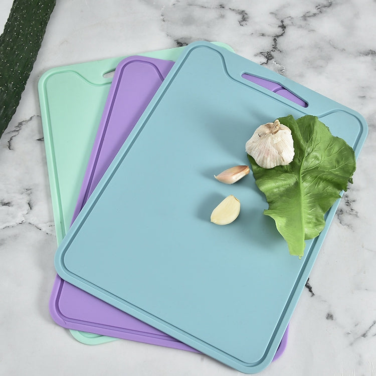 Set of silicone cutting boards with rounded corners in teal and purple