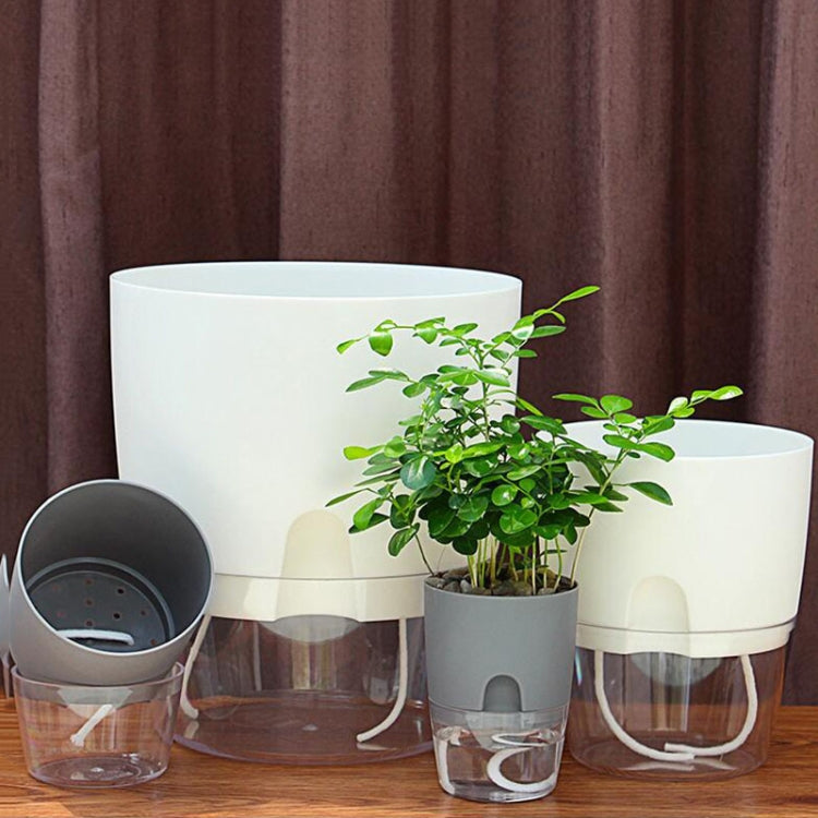 Clear and white double-layer water storage flowerpots with gray inner bases