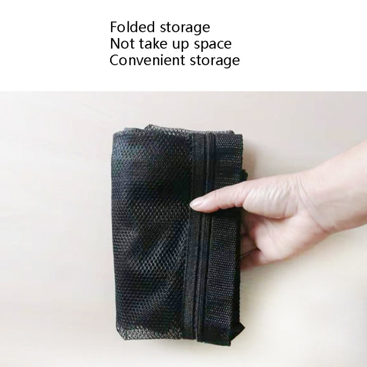 Folded black mesh hanging storage bag with centered zipper
