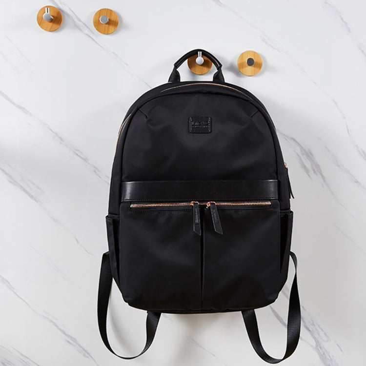 Black backpack with front zipper and two round bamboo hook mounts