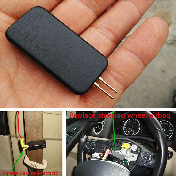 Black car airbag detection tool in hand with two gold pins, compact rectangular casing