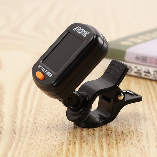 Black clip-on electronic tuner with LCD screen and pivoting mounting clip
