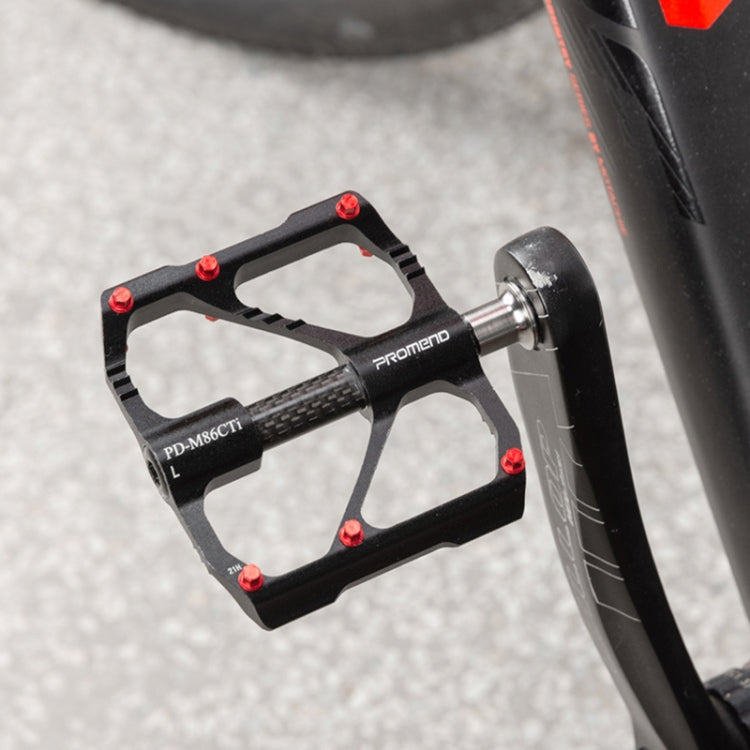Carbon bicycle pedal mounted on a road bike, side view with titanium axle