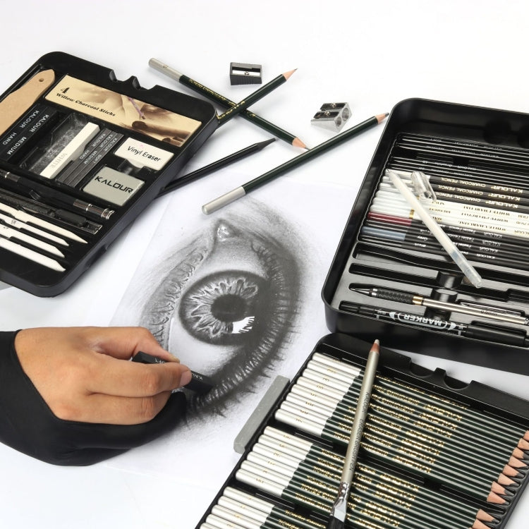Hand sketching on paper with graphite pencil set in open black case