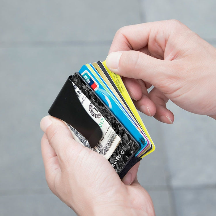 Slim black card holder showing multiple cards stacked in front pocket
