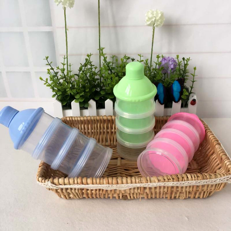 Set of portable milk powder dispensers in blue, green, and pink in a basket