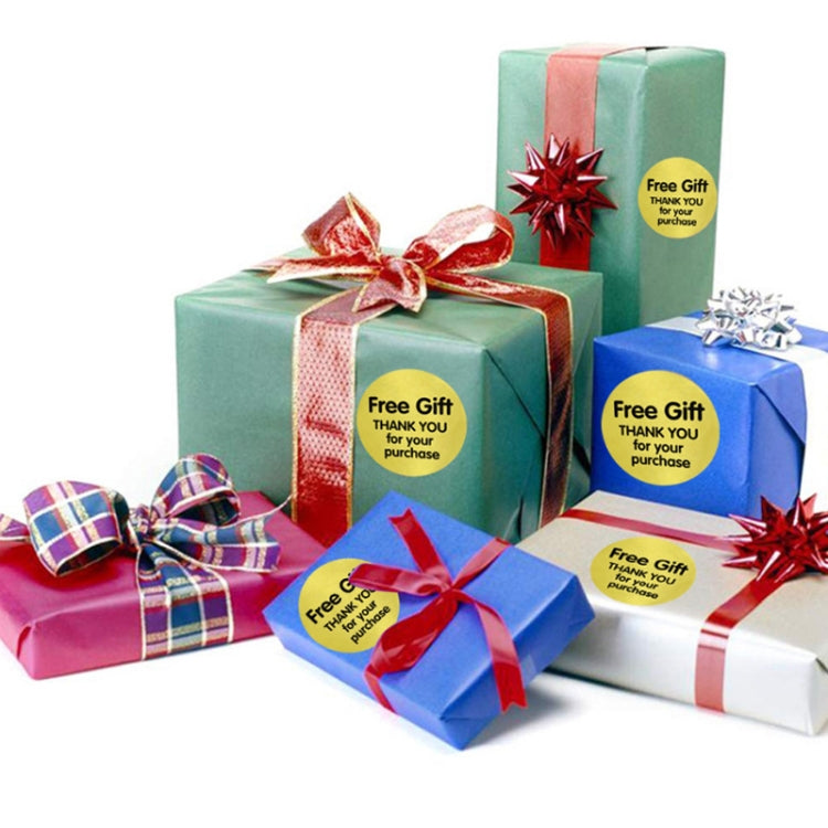 Yellow “Free Gift / Thank you” stickers on wrapped gift boxes