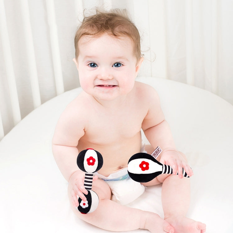 Plush baby rattle pair with black/white ball ends, striped handles, red flower faces