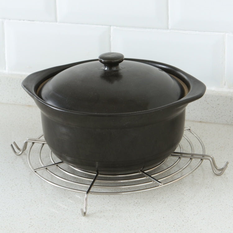 Semi-circular stainless steel drain rack supporting a black pot on the stovetop