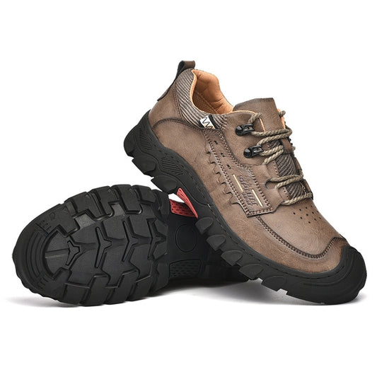 Men's khaki hiking shoes with lace-up closure and thick treaded rubber outsole