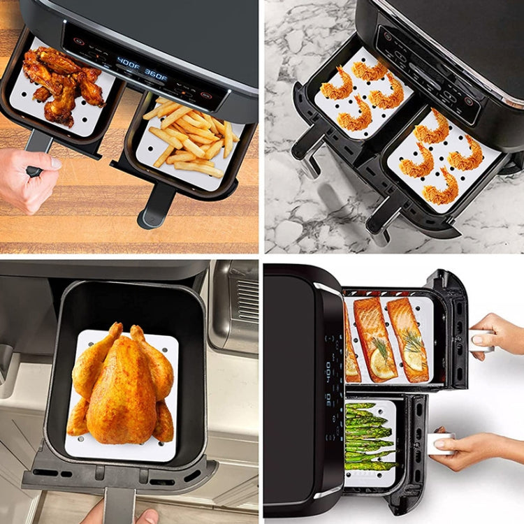 Oil-absorbing air fryer paper liners in fryer basket for fries, chicken, and fish