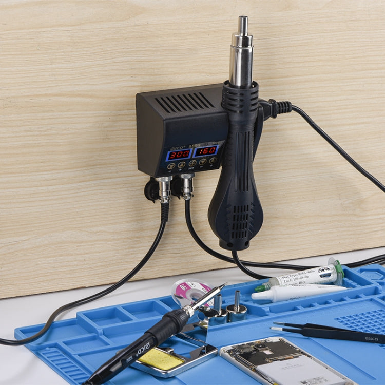 Hot air desoldering station setup with handle, base unit, and work tools on tray