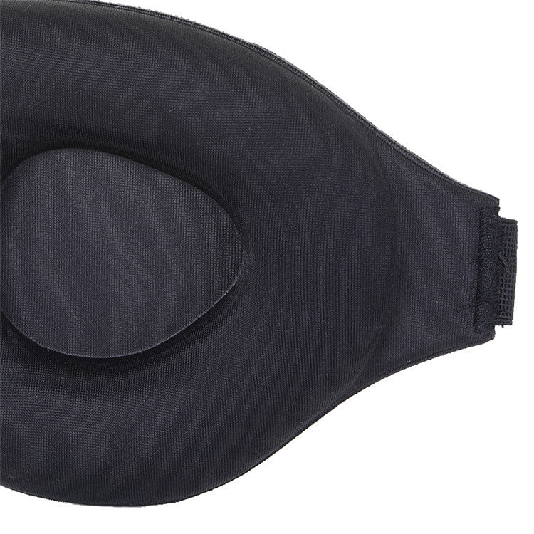 Side view of black 3D sleeping eye mask with adjustable strap and concave cups