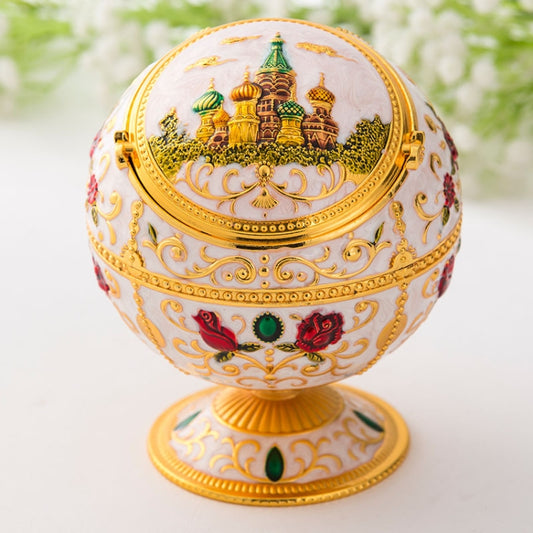 Metal globe ashtray with lid, white dome with golden castle scene and floral ornaments