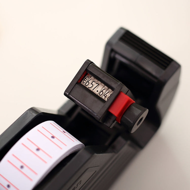 Close-up of label printer window and red latch near the label roll