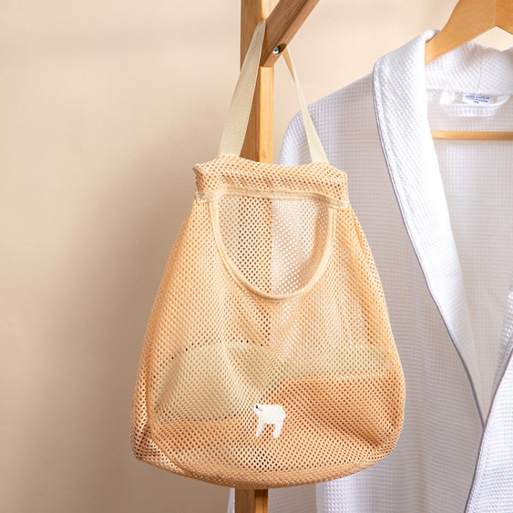 Orange mesh wall-hanging produce storage bag hanging by top loop on a wooden hook