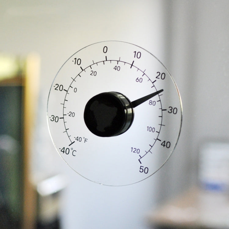 Round outdoor thermometer with glossy sensor knob and visible °F/°C temperature scale
